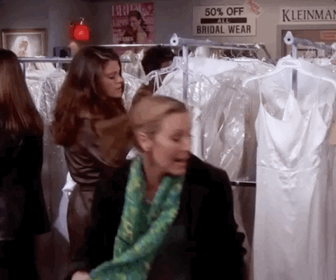 Phoebe from friends running in circles in a wedding shop.